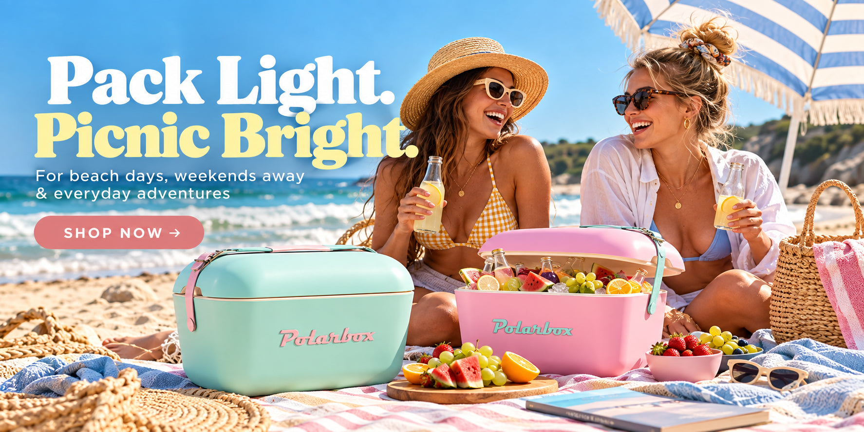 Two friends enjoying their Polarbox coolers on a beach in Cape Town
